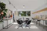 The other two bedrooms on the upper level are currently used as a studio space and a den.