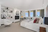 The primary bedroom is on the upper level and has its own bathroom and fireplace.