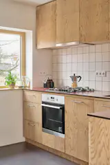The kitchen, which was a bigger spend for the renovation, has a tile backsplash.