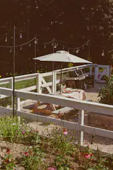 The vegetable garden, picnic table dining area, and barbecue zone are all contained by a fence.