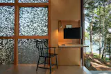 When returned to its upright position, the desk stays in position via magnets.