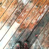 Adding the wood brightener.  Don't have a dumb deck, brighten it with Superdeck wood brightener. The brightener will also neutralize any remnant wood stripper from the previous step, so it has double benefits, plus it's pretty satisfying watching the wood brighten right before your eyes.