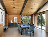 A paneled, gabled roof with exposed rafters means high ceilings with visual interest in this home in Los Angeles. To allow maximum light to enter the living areas and keep the wood-paneled areas bright, Abramson Teiger Architects located the kitchen, living, and dining rooms on the top floor rather than on the first floor.