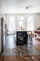 The first floor of this house, built in1885 and located in the McGill neighborhood of Montreal, was the perfect spot for a large kitchen and living area, which was missing from the old layout—a makeshift kitchen was previously located on the floor above. The clients, a web developer and a jewelry designer with a son, wanted a centralized space for eating and entertaining. The kitchen island contains three cabinets from IKEA, retrofitted with custom doors, as well as a dishwasher.