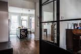 Kitchen A custom glass-and-steel partition, made by Atelier Gris, separates the living room from the kitchen while maintaining visibility between the spaces.  Photo 6 of 6 in Historic Montreal House Meets DIY IKEA