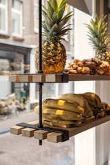 Suspended shelves made of wood planks display organic ingredients. Photo by Wouter van der Sar.  Photo 6 of 9 in Things I like by Nicholas Price from A Tree Grows in Amsterdam