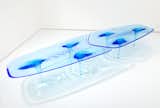 Zaha Hadid’s Liquid Glacial dining table and chair are crafted with acrylic that’s been manipulated to look like suspended pieces of formed ice.&nbsp;