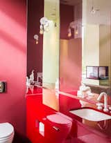 The vibrant color scheme is continued throughout the property, even into the smallest of spaces—as shown here in one of the bathrooms. &nbsp;&nbsp;