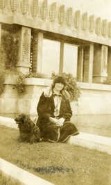 Shown here is Aline Barnsdall herself, lounging on the grounds of the Hollyhock House with her dog. The story of the residence could not be told without the powerful presence she held over the project.&nbsp;