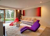 Shown here is the sitting room in the bottom half of the main house. As an art collector, the current homeowner has filled the entire interior with bold statement pieces.  Photo 9 of 10 in After a Year on the Market, Philip Johnson’s Wiley House Drops by $2 Million