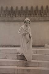 An archival photo of Elizabeth Barnsdall's daughter Elizabeth (nicknamed Sugartop) standing at the Hollyhock House. From the collection of David Devine; Courtesy of the Hollyhock House.