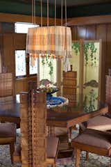 At Frank Lloyd Wright's Hollyhock House in Los Angeles, the hollyhock motif even runs up the spine of the custom dining furniture set.