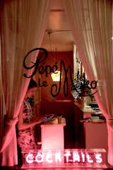 The entrance to Pépé le Moko is mysterious, and welcomes you with a bright pink fluorescent sign. Once you check-in up front, you’re led downstairs to the tightly-packed, cozy space.&nbsp;