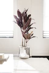 Also in the lounge/waiting area sits rounded metal planters that are part of Early Work’s product line. Throughout the space are versions in both a high polished mirror finish (shown here) and a textured powder-coated finish.