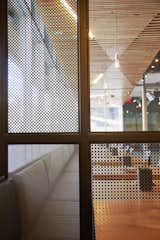 In order to help create a bit of privacy in certain areas of the Santa Monica locale, they created perforated metal screens that were are by traditional shoji screens.