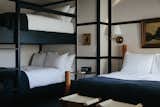 The beds are topped off with custom hand-dyed French linen blankets from Brooklyn-based Sharktooth. Additionally, each room is finished with high-gloss painted plywood floors that have a decorative wood trim running the edge of the room.&nbsp;