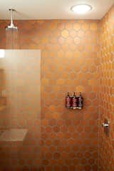 Each room’s bathroom is equipped with showers lined with Terracotta tile, modern rain showers, and skin and haircare products made exclusively for Scribner’s.