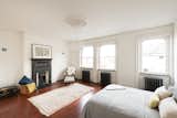 Among the five bedrooms is a master suite in the eaves that has an en-suite bathroom, freestanding bath, and a dressing area complete with under-eaves storage.  Photo 4 of 8 in Bedrooms by SF Design Build from A Fusion of Old and New Makes this Home For Sale Shine on London’s Womersley Road