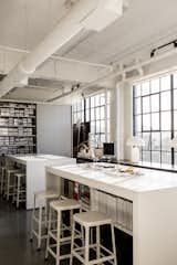 Hollis made sure to create areas where vendors, artists, and artisans can drop off their work or samples. Shown here is the materials library and high-top tables that provide storage and allow for casual, impromptu meetings.  Photo 10 of 13 in A San Francisco Design Collective Reveals its Impeccably Cool Creative Studio