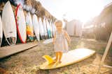 Grant Ellis has been a photo editor at Surfer Magazine for 13 years and lives in a quaint beach shack in Cardiff, California, with his wife Julie, son Ethan, and daughter Kaia (shown here).