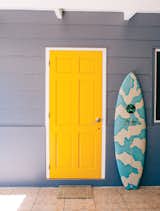Known as the “unofficial ambassador of Tahiti,” Raimana Van Bastolaer lives in a beach house right on the water in Papara on the south side of Tahiti. The bright details found throughout his home perfectly represent the personality that everyone in the surf industry calls up looking for a good time on their visit Tahiti.