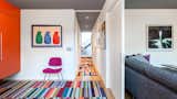 The ground floor  holds the two kids’ bedrooms, which were remodeled a bit but kept consistent with the original footprint of the house. A media room sits behind a pocket door, also on the ground level.