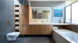 In the master bathroom, they installed bamboo cabinetry from Plyboo, a San Francisco-based company that thrashes and presses bamboo into dense logs that are then sliced and fabricated into the surface of your choice.