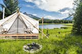 The team behind Collective Retreats built the custom canvas tents with wood that they sourced locally. They used timber they found in the property’s vicinity to hold the peaks together at the top. Shown here is the Yellowstone location.&nbsp;