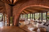 Liebermann and his wife Eva did the brickwork in the house—the most impressive section being the two arches that hover over the living areas and are surrounded by the home’s old-growth redwood structure.&nbsp;