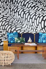 In the covered cabana area by the pool, a hand-painted mural by Brendan “The Blob” Monroe creates a funky backdrop that's inspired by the flow of water. Local artist, illustrator, and curator Jasper Wong co-curated the mural artwork found throughout the property.