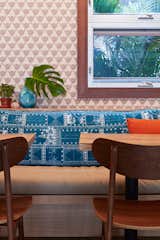 The aloha spirit runs deep in Mahina &amp; Sun’s, where the walls are covered with a shaka wallpaper by Andrew Mau. The cushions on the banquette seats were made with archived prints by Tori Richard, which were also used to create the headboards in the guest rooms and the men’s uniforms.