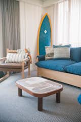 Studio Collective designed the 112 rooms based on the bungalows of Oahu’s North Shore. They feature reed ceilings, batten walls, local art, and bespoke coffee tables that are topped with ceramic tiles.