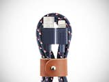 Native Union Belt Cable

If you’re planning your summer vacation or a weekend away, don’t forget to pack a Native Union Belt Cable. This micro USB to USB charging cable is designed to remain untangled at all times, even when you throw it at the bottom of a travel bag. The Nautical pattern features a navy blue color and red and white details. Braided from durable nylon, the cable is flexible but rigid and comes with a brown leather belt.