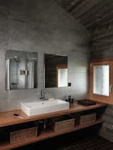 Bath Room, Wood Counter, Vessel Sink, and Concrete Wall  Photos from House on the Water by Galletti & Matter Architectes