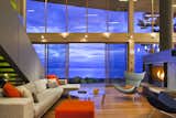 The broad interior two-story living room is a thickened wooden frame to view the Georgia Straight beyond, where wild winter storms rage and bald eagles hunt. 

#livingroom #bright #hearth #beachhouse #beachhouses #evening #oceanfront #oceanviews #britishcolumbia #vancouverislands #comox #interstice #intersticearchitects #interiordesign #bradlaughton #bradlaughtonphotography