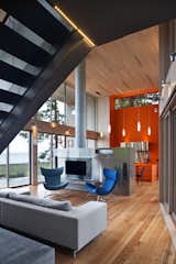 A bold orange vertical excavation of the frame accents the kitchen and provides a second bright counterpoint to the long, grey, Canadian winters. 

#kitchen #bright #color #orange #hearth #livingroom #beachhouse #oceanfront #beachhouses #britishcolumbia #vancouverisland #interstice #intersticearchitects #bradlaughton #bradlaughtonphotography 