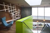 An intimate, peaceful study area at the top of the staircase provides a quiet moment for guests, and unique storage solutions in the cabinetry and shelving. 

#shelving #green #limegreen #bright #color #staircase #storage #beachhouse #beachouses #interstice #intersticearchitects #bradlaughton #bradlaughtonphotography #britishcolumbia #vancouverisland

