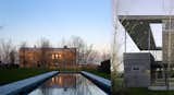 #LouverHouse #modern #midcentury #dynamic #landscape #two-story #lighting #windows #staircase #exterior #outside #wood #panels #pool #angles #naturallighting #NewYork #LeroyStreetStudio