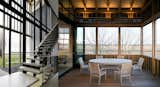 #LouverHouse #modern #midcentury #dynamic #landscape #two-story #lighting #windows  #interior #inside #seating #table #staircase #exterior #outside #wood #panels #NewYork #LeroyStreetStudio