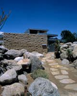 #KaufmannHouse #modern #midcentury #Nuetra #1946 #restoration #archival #original #details #lighting #windows #exterior #outside #outdoors #landscape #pathway #stone #rock #PalmSprings #California #MarmolRadziner 