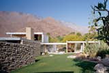 Outdoor, Grass, Back Yard, Gardens, Flowers, Desert, Boulders, Side Yard, Stone Fences, Wall, and Hardscapes #KaufmannHouse #modern #midcentury #Nuetra #1946 #restoration #archival #original #details #lighting #windows #exterior #outside #outdoors #landscape #views #green #PalmSprings #California #MarmolRadziner   Photos from Kaufmann House