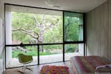 #RatnerResidence #modern #midcentury #canyon #two-story #structural #wood #interior #inside #windows #glass #bedroom #bed #rug #Eames #chair #MarmolRadziner