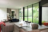 #RatnerResidence #modern #midcentury #canyon #two-story #structural #interior #inside #windows #glass #livingroom #naturallight #seating #chairs #table #MarmolRadziner