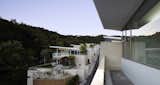 #SeongbukdongResidence #modern #midcentury #enclave #sustainable #L-shaped #exterior #outside #outdoors #structure #balcony #windows #glass #street #rooftops #wood #green #Seoul #JoelSandersArchitects