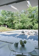 #BedfordResidence #1950s #modern #midcentury #exterior #outside #outdoors #landscape #green #structure #deck #stone #table #chairs #poolhouse #chaiselounge #Bedford #BalmoriAssociates #JoelSandersArchitect