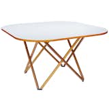 Rare dining table, 1979, by Vico Magistretti. White laminate top framed in beech; legs of beech with steel and brass fittings.