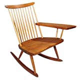 This 1970s walnut rocking chair by Japanese American woodworker George Nakashima features hickory spindles and his signature "free edge" arm.  Photo 8 of 8 in Imaginary Sunday Shopping List by Amanda Dameron