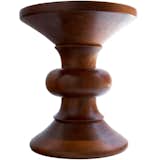 This is an early example of the Time-Life stool created by Charles and Ray Eames for the Time-Life lobby in New York, circa 1960. It should be noted that this piece, made of lathe-turned walnut, was largely Ray's conception. She was reportedly inspired by Brancusi and African chairs. 