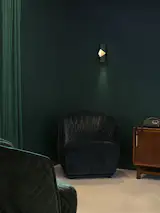 Concealed LED lights add to the allure of the Notch sconce, and create a soft glow against its brass interior.