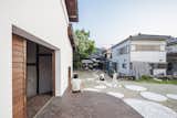 Outdoor, Side Yard, Walkways, Wood Patio, Porch, Deck, and Decking Patio, Porch, Deck Extending to the outdoors, the stage invites engagement from passersby.  Photo 6 of 8 in Saved From Demolition, a Japanese Sake Warehouse Sees a Second Life